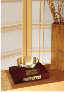 Zen Timepiece, a bowl/gong alarm clock and timer in cherry finish