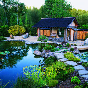 Flecked with water lilies and fringed with greenery, a heart-shaped pond exemplifies the spirit of the Osmosis Meditation Garden. A stone path leads visitors across a small bridge to the Moon Pavilion Flecked with water lilies and fringed with greenery, a heart-shaped pond exemplifies the spirit of the Osmosis Meditation Garden. A stone path leads visitors across a small bridge to the Moon Pavilion